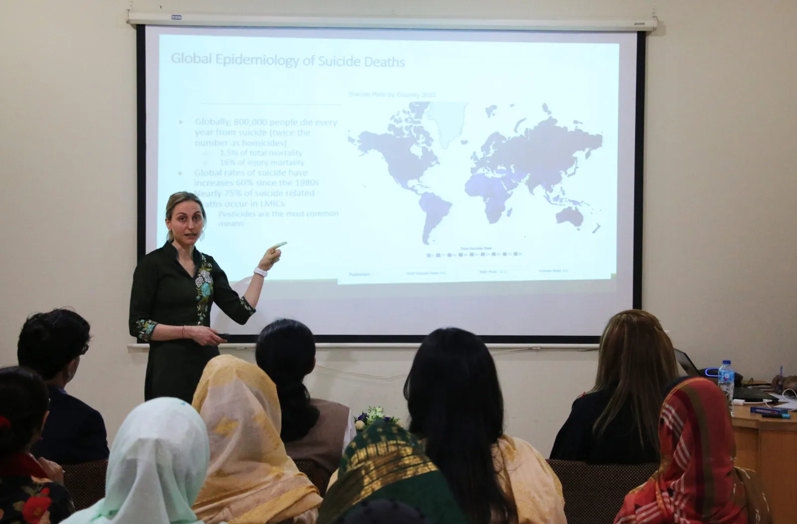 Dr. Ashley Hagaman presenting on the global epidemiology of suicide at the GIHD qualitative research methods workshop