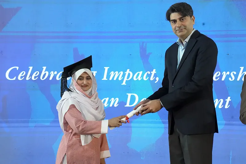 IPHNM graduate receiving diploma from Dr. Malik Mukhtar Ahmad Bharath, Minister of State for National Health Services, Regulations and Coordination, at Annual Day 2026