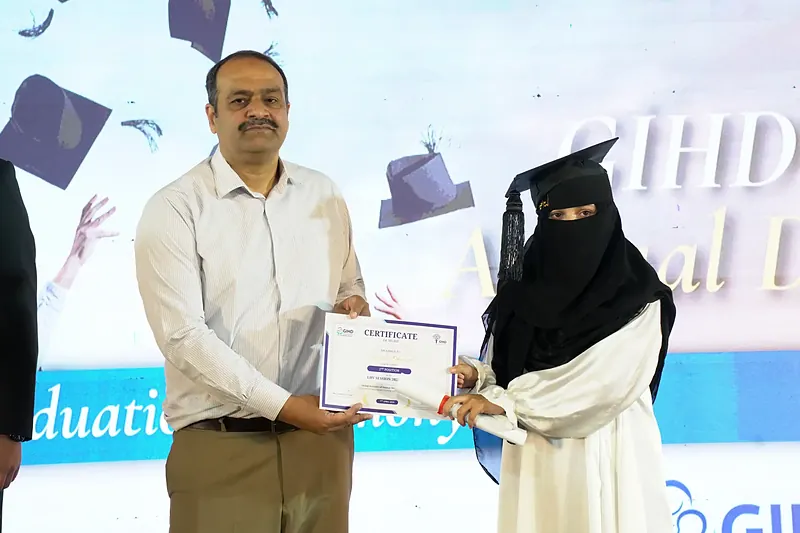 LHV student receiving Certificate of Merit for 2nd position from Dr. Ehsan Ghani, CEO District Health Authority Rawalpindi, IPHNM Annual Day 2026