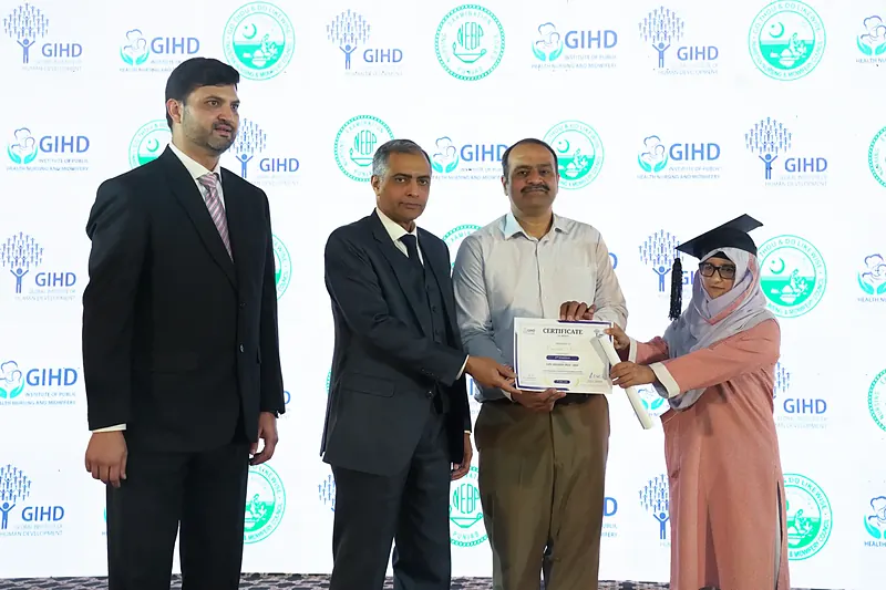 Certificate of Merit presented by Dr. Ehsan Ghani, CEO District Health Authority Rawalpindi, alongside Maj Gen Abid Ejaz Kahloon HI(M) R, Chair Board of Trustees GIHD, LHV Session 2024 to 2026, IPHNM Annual Day 2026